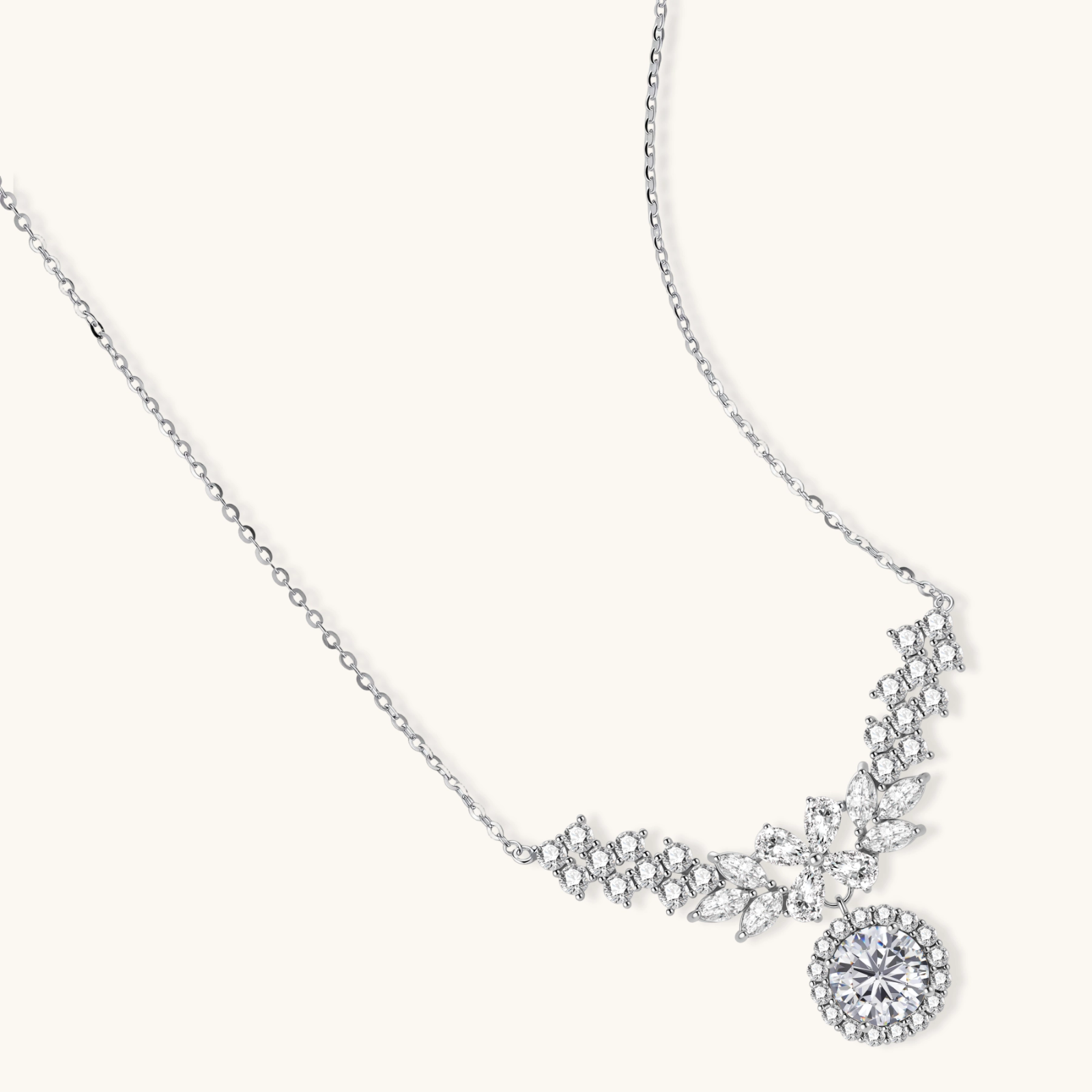 242033274747572224.webp Elegant sterling silver necklace featuring intricate wing-like design with brilliant moissanite stones on neutral background.