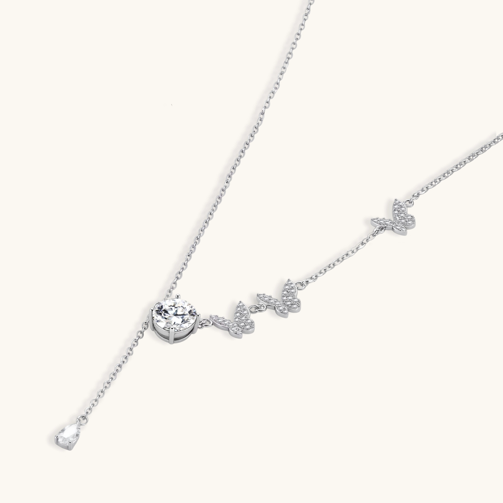 242033963177766912.webp Sterling silver Y-shaped necklace with butterfly charms and brilliant moissanite stone with teardrop pendant