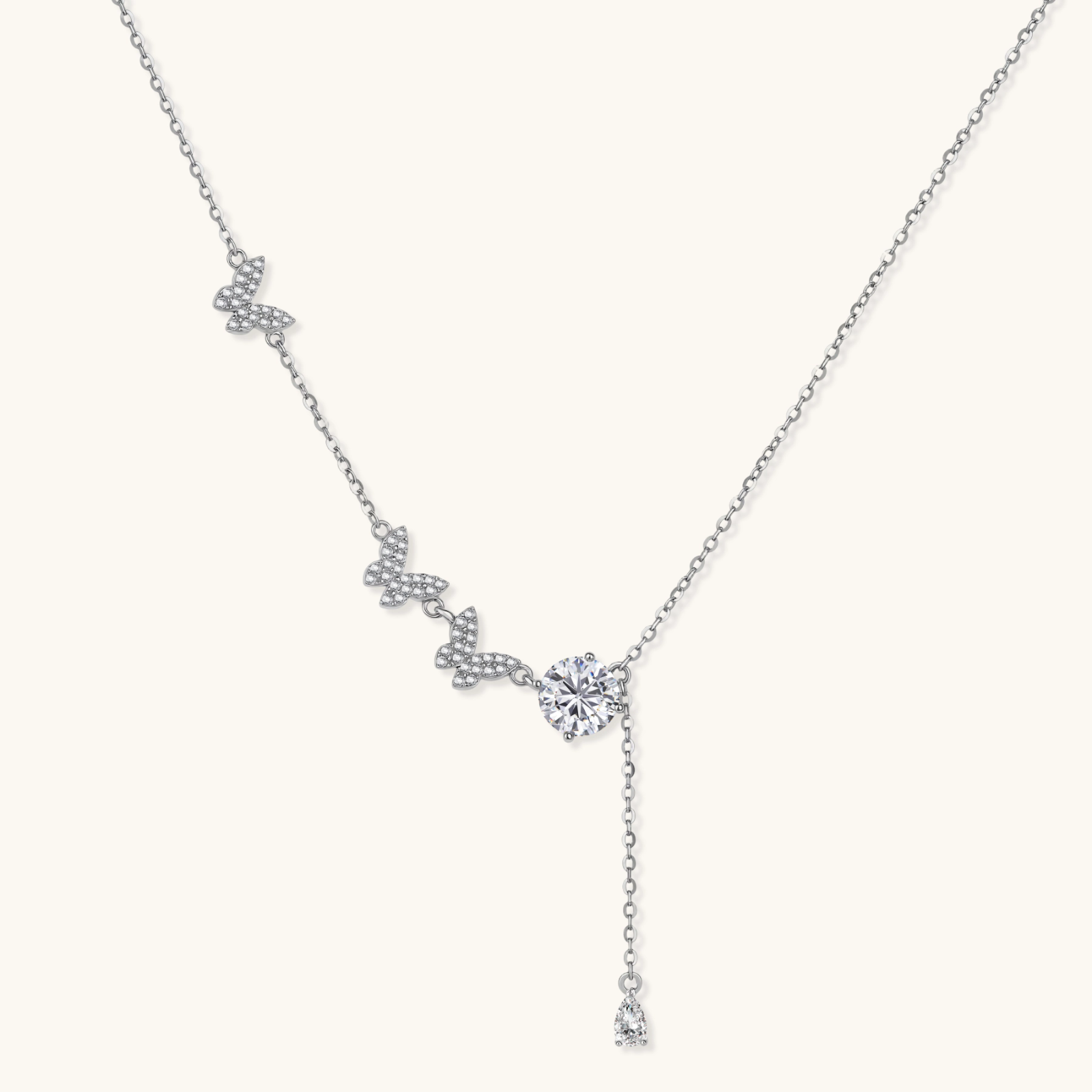 242033963211321344.webp Sterling silver Y-shaped necklace with butterfly charms and brilliant moissanite stone with teardrop pendant