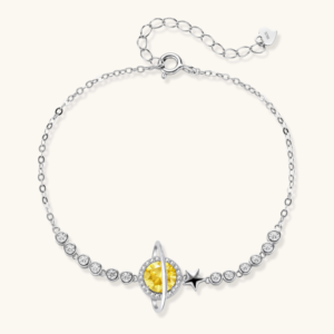 Collections Sterling silver bracelet with yellow moissanite centerpiece in oval setting, crystal chain, and star charm on white background.