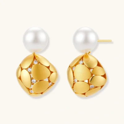 Gold-plated sterling silver drop earrings with white freshwater pearl studs and overlapping petal design with crystal accents
