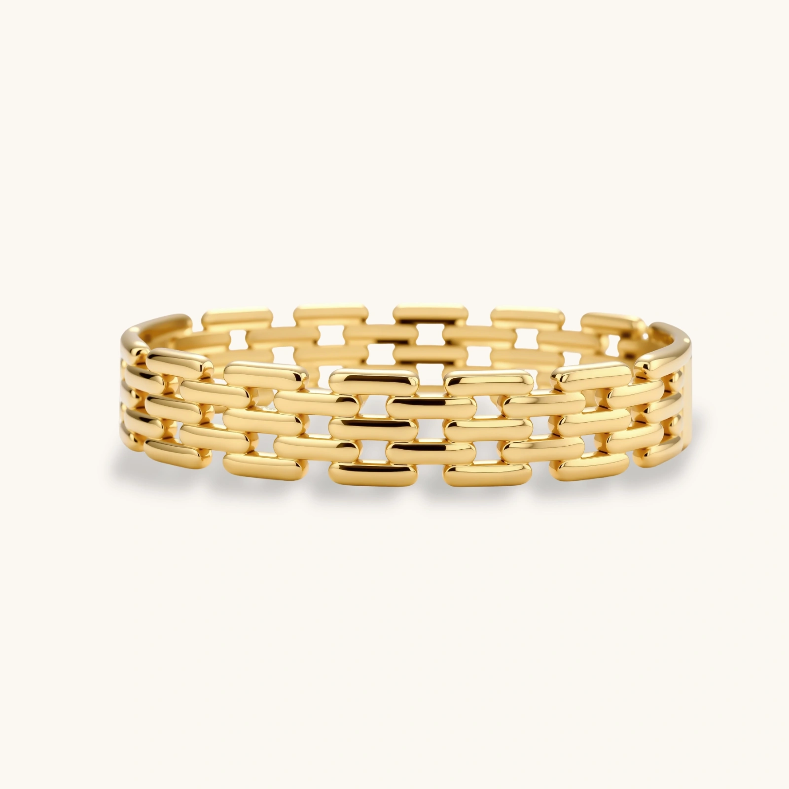 grid link bracelet Wide 18K gold plated stainless steel bracelet with a multi-row rectangular grid link chain pattern on a cream background.